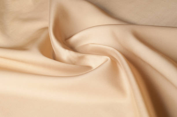 istock Texture background of fabric. Beige fabric. Silk fabric wallpaper texture background pattern in sepia pastel yellow cream beige tint: Lovely natural silk textured textile 966141994
