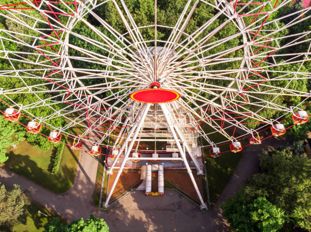 istock ferris wheel at an amusement park. aerial view. 966142312