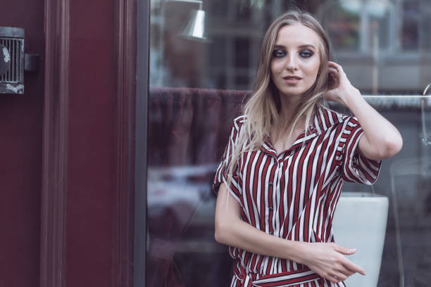 istock Long-haired model poses outside vintage cafe 966152930