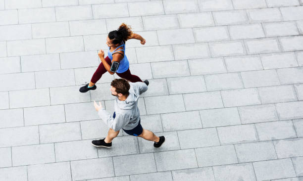 istock Sporty couple exercising outdoors together 966181648