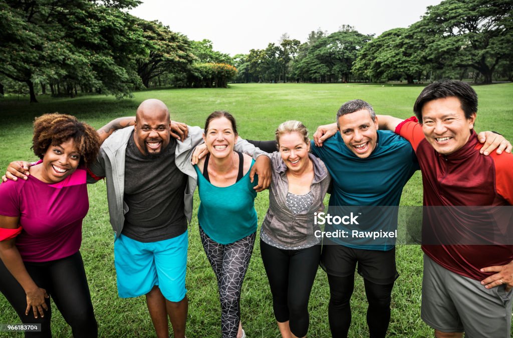 Group of cheerful diverse friends in the park Multiracial Group Stock Photo