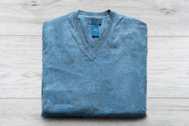 istock Sweater on wooden background 966187934