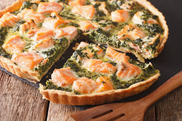 istock sliced Savory quiche with salmon and spinach, close-up. Horizontal 966188998