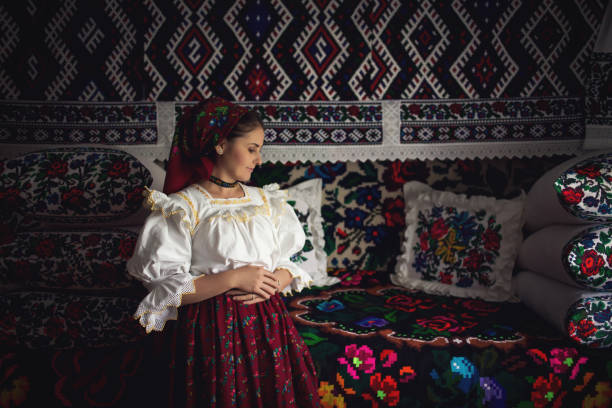 Portrait of a beautiful young woman in Maramures Portrait of a beautiful young woman wearing traditional Romanian clothes, in Maramures maramureș stock pictures, royalty-free photos & images