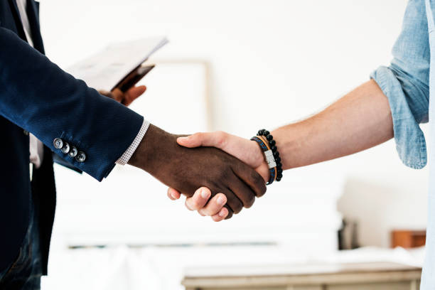 istock Closeup of hands shaking together 966189412