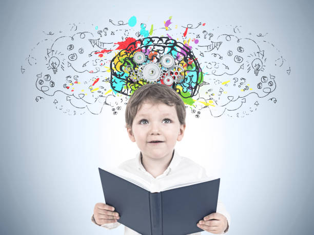 istock Cute little boy with a book, cog brain 966194082