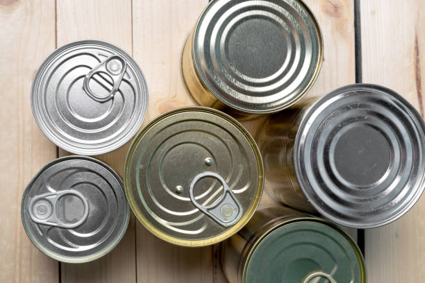 istock Tin cans for food on wooden background 966198018