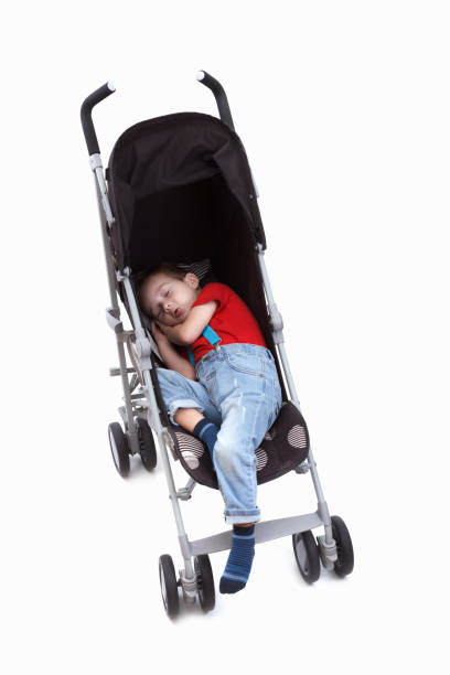 istock Happy baby boy in an stroller. On white. 966199574