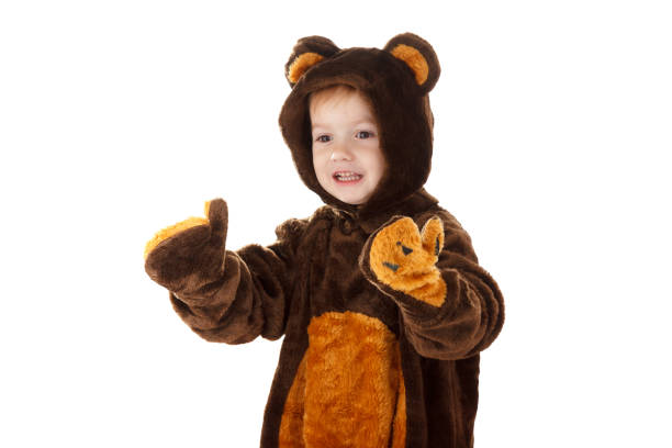 istock baby in teddy bear costume on white background 966199926
