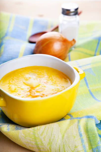 istock Cheese soup in a yellow plate 966199994