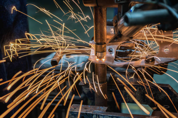 istock Close-up spot machine is welding nut to steel part 966209998