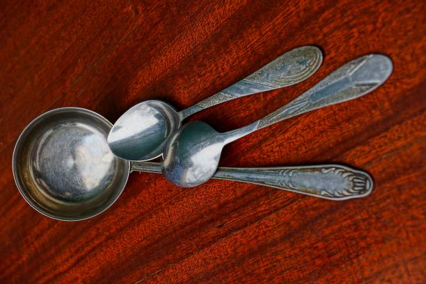 istock Iron ladle and spoon on red table 966223644
