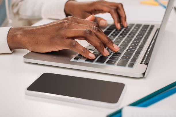 istock female hands typing on laptop 966230000