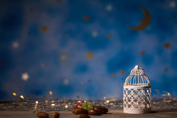 istock Dates and candle holder on a wooden surface. 966234556