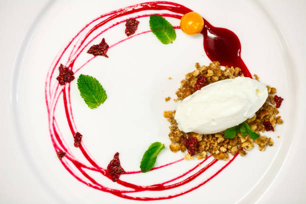 istock concept cheesecake with raspberry sauce, chips and mint on a white plate. Top view 966238262