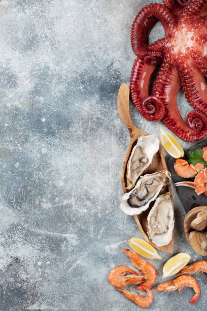 istock Seafood. Octopus, oysters, lobster, shrimps 966239354