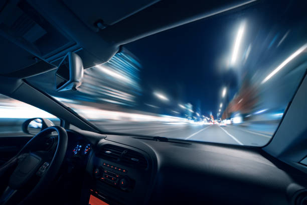 Car speed drive on the road in night city stock photo