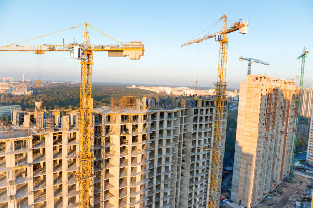 istock Cranes on industrial building site 966248386