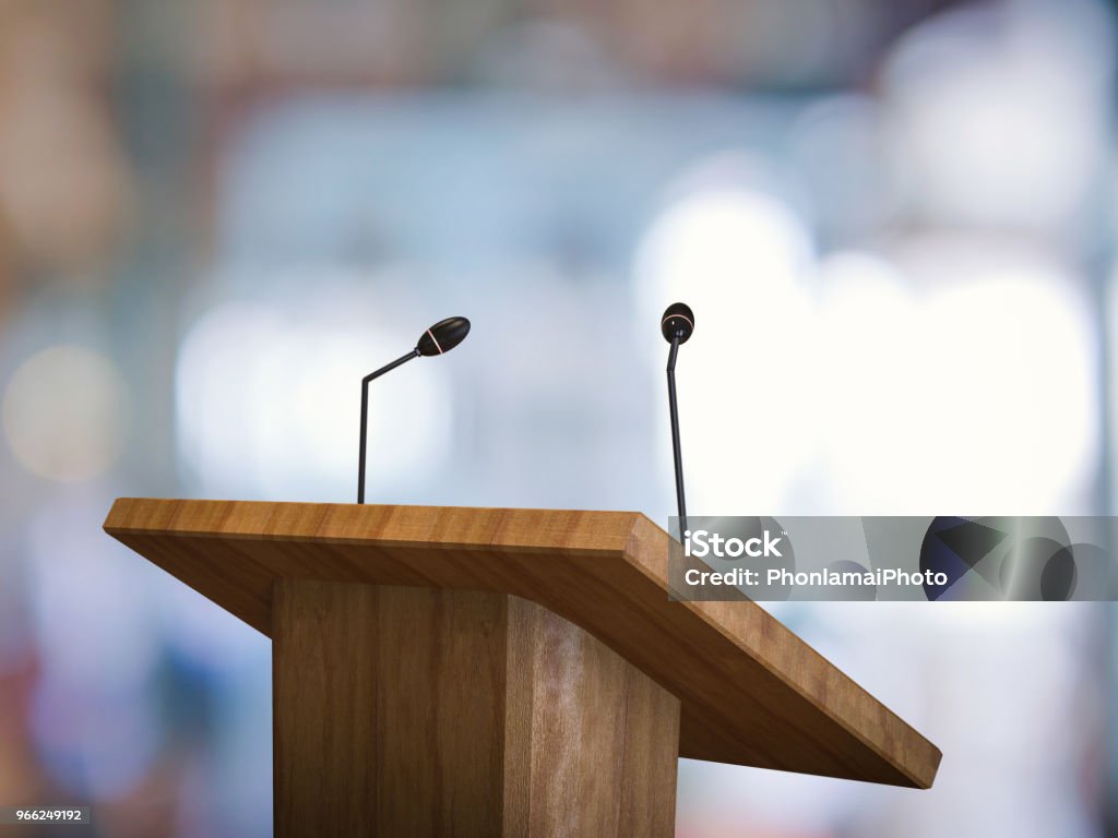 podium with microphone 3d rendering wooden podium with microphone on blurred background Lectern Stock Photo
