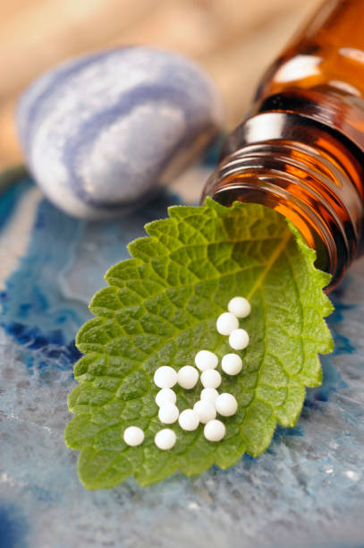 istock alternative medicine with herbal and homeopathic pills 966252448