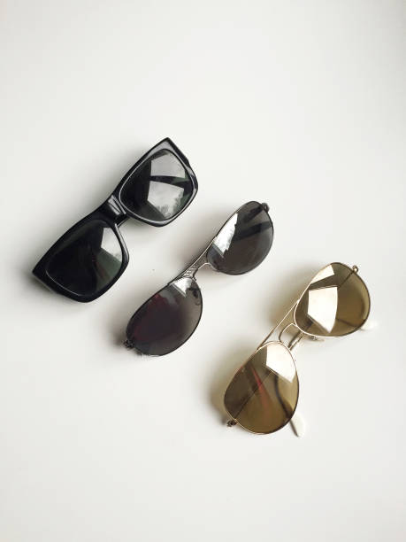 istock Top view of three different types of sunglasses on white background. 966256944