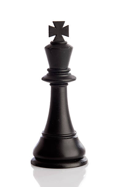 Silver chess king with the shadow of a queen.