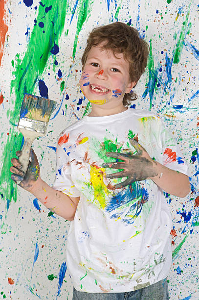 istock Little boy playing with painting 96626254