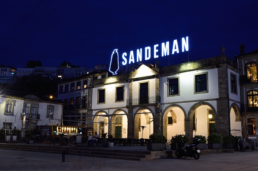 Gaia, Portugal - May 19, 2018: Sandeman cellar in the historic centre of Vilanova de Gaia, Portugal. Sandeman is a brand of Port wines founded in 1790.