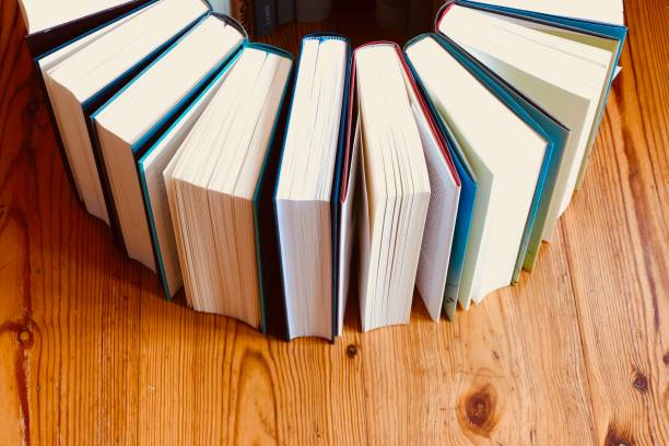 istock Circle of books on parquet floor 966263078