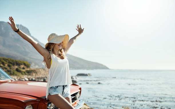 Cropped shot of an attractive young woman on a road trip