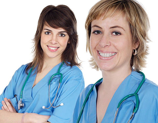 istock Couple of young doctors a over white background 96626590