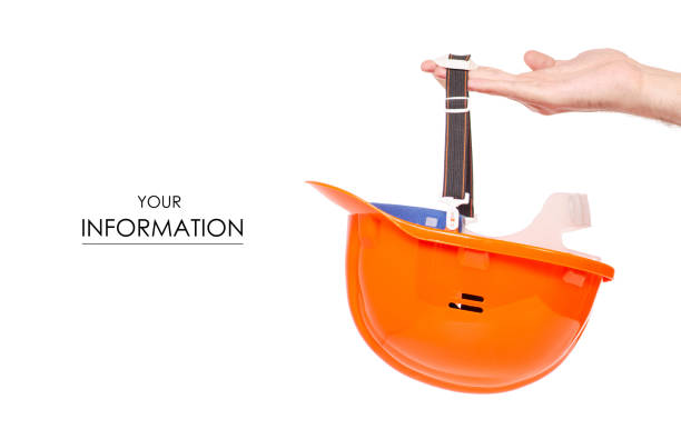 Orange man's helmet in man's hand pattern on a white background isolation