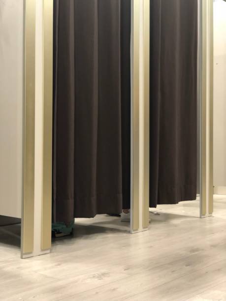 istock fitting rooms with people 966271738