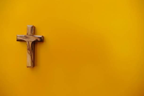 istock Wooden Crucifix on orange background 966276648