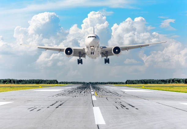 istock Passenger airplane landing at in clouds sky on a runway. 966280686