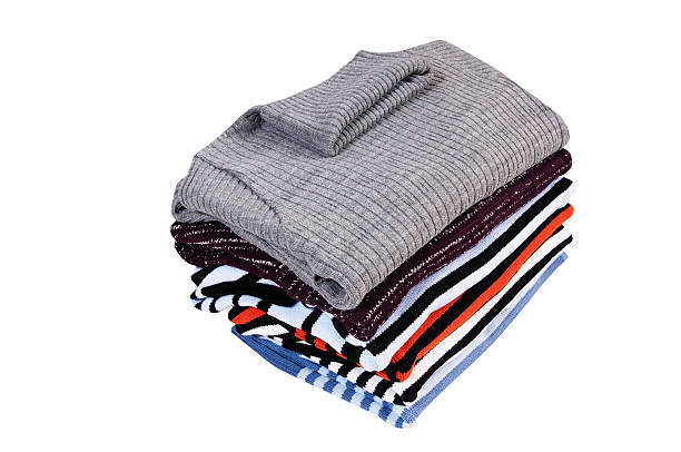 istock Heap of  sweaters on a white. 96628290
