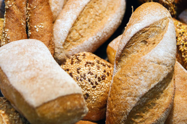 istock freshly baked bread and bakery products on the counter. background 966284054