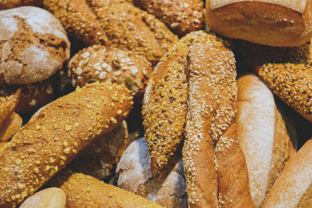 istock freshly baked bread and bakery products on the counter. background 966284194