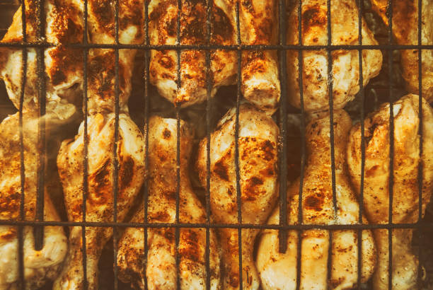 istock Fried roasted grilled chicken legs . BBQ Grill background 966284348