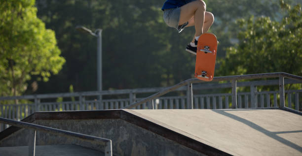 istock skateboarder skateboarding on skatepark ramp 966285404