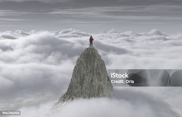 A Man Standing On A Stone Cliff Over The Clouds Success Concept Stock Photo - Download Image Now