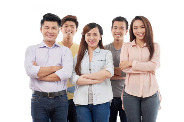 Cheerful young Vietnamese business team on white background