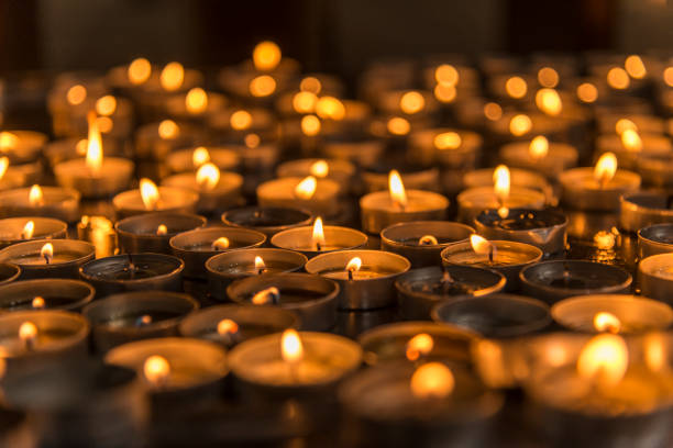 istock Prayer candles in a church 966288686