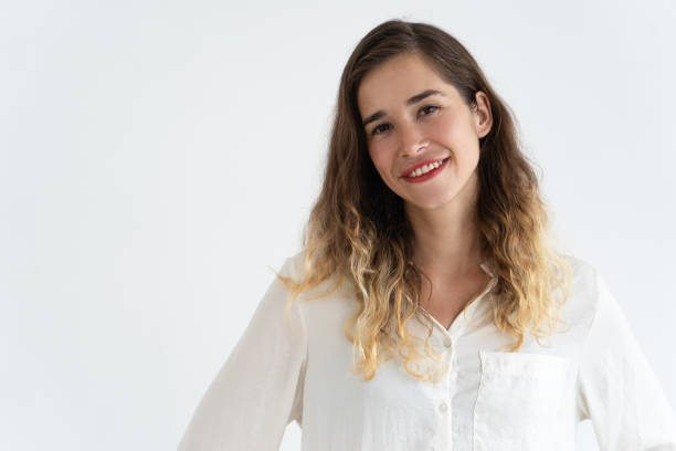 istock Smiling beautiful young woman looking at camera 966290324
