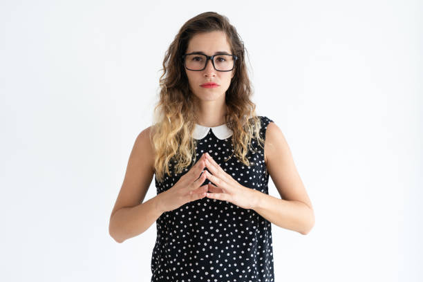 istock Thoughtful pretty woman holding hands together 966290558