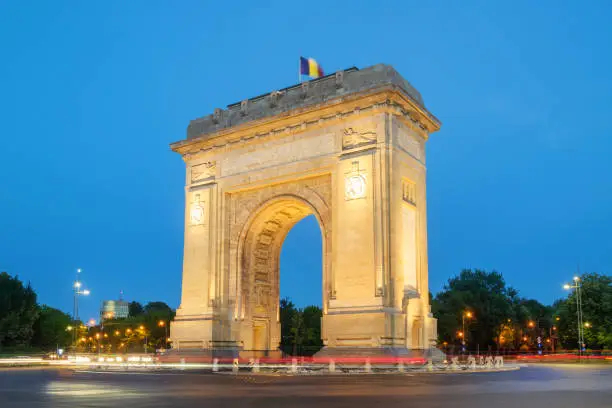 Bucharest, the Triumphal Arch  or Arcul de Triumf, at dusk