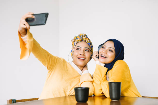 Young Women Taking Selfies