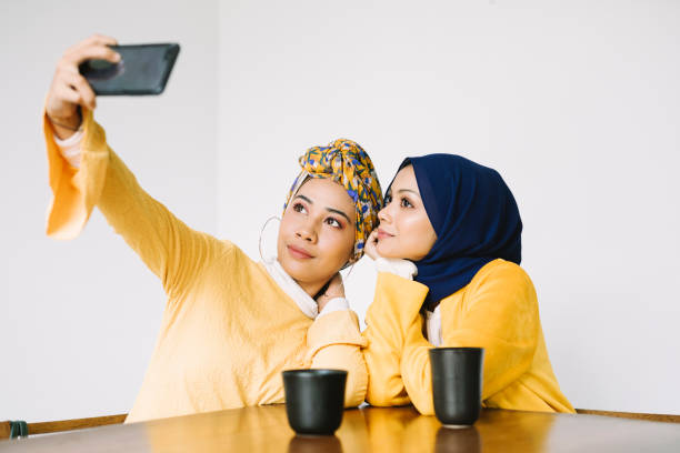 istock Young Women Taking Selfies 966293956