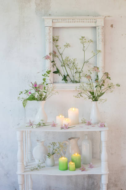 istock white vintage interior with flowers and candles 966294802