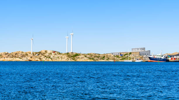 istock Coastal landscape with wind turbines 966303152